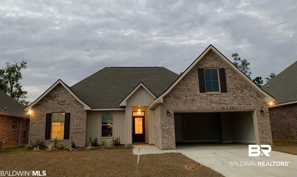 1009 Ruisseau Drive Foley, AL 36535 - Photo 3 of 55 View of front of home with a garage