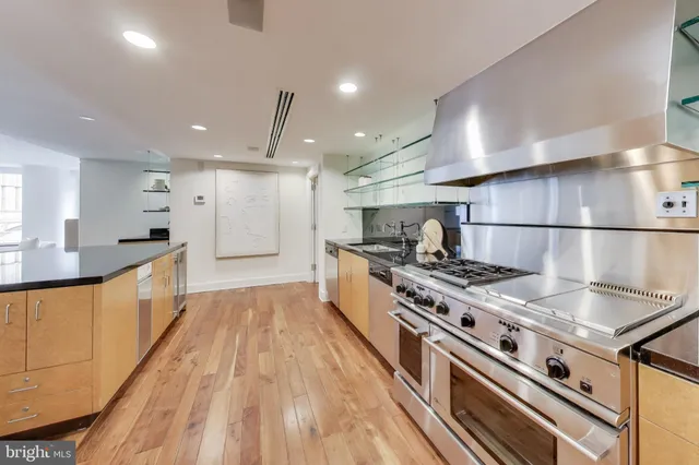 a view of kitchen with furniture and wooden floor