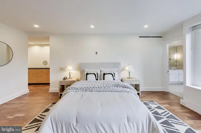 a bathroom with a granite countertop sink mirror and shower