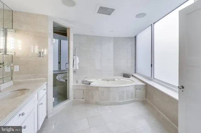 a view of walk in closet with wooden floor