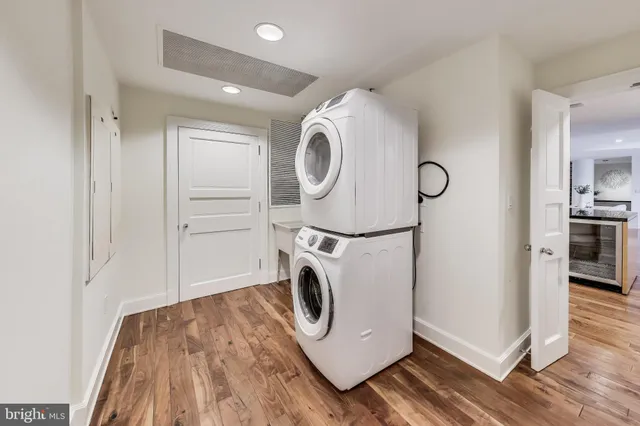 a house with tall trees in front of it
