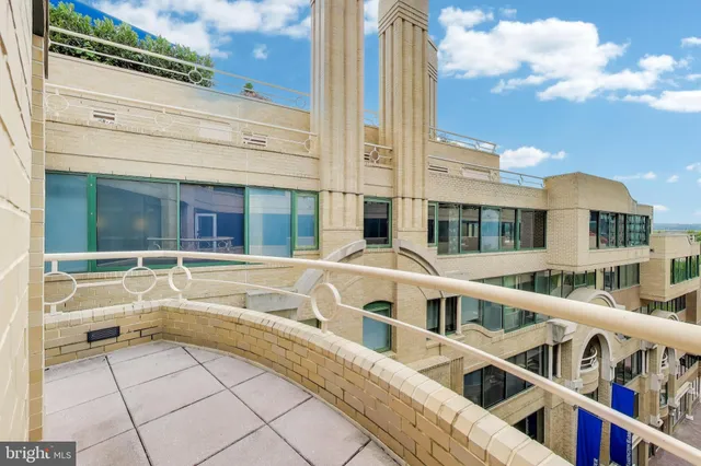 a bedroom with a large bed and a large window