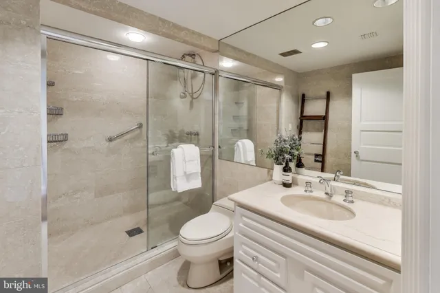 a bathroom with a bathtub and shower