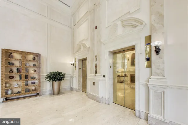 a view of a room with a furniture and mirror