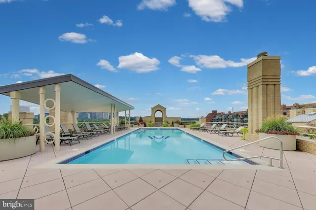 a night view of a lake with a garden and a yard