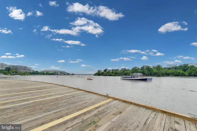 a city street lined with buildings and trees