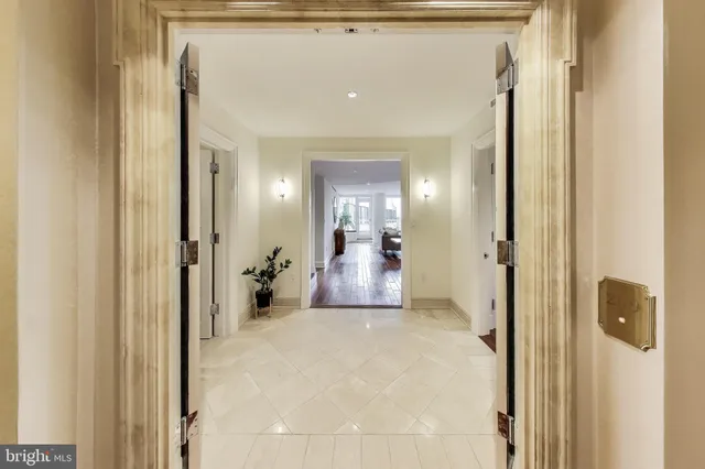 a living room with fireplace furniture and a wooden floor