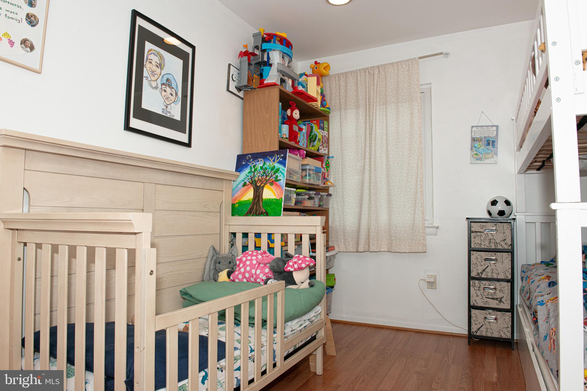 9908 Bustleton Avenue, Unit A8 Philadelphia, PA 19115 - Photo 15 of 24 a bedroom with baby crib and hanging chair