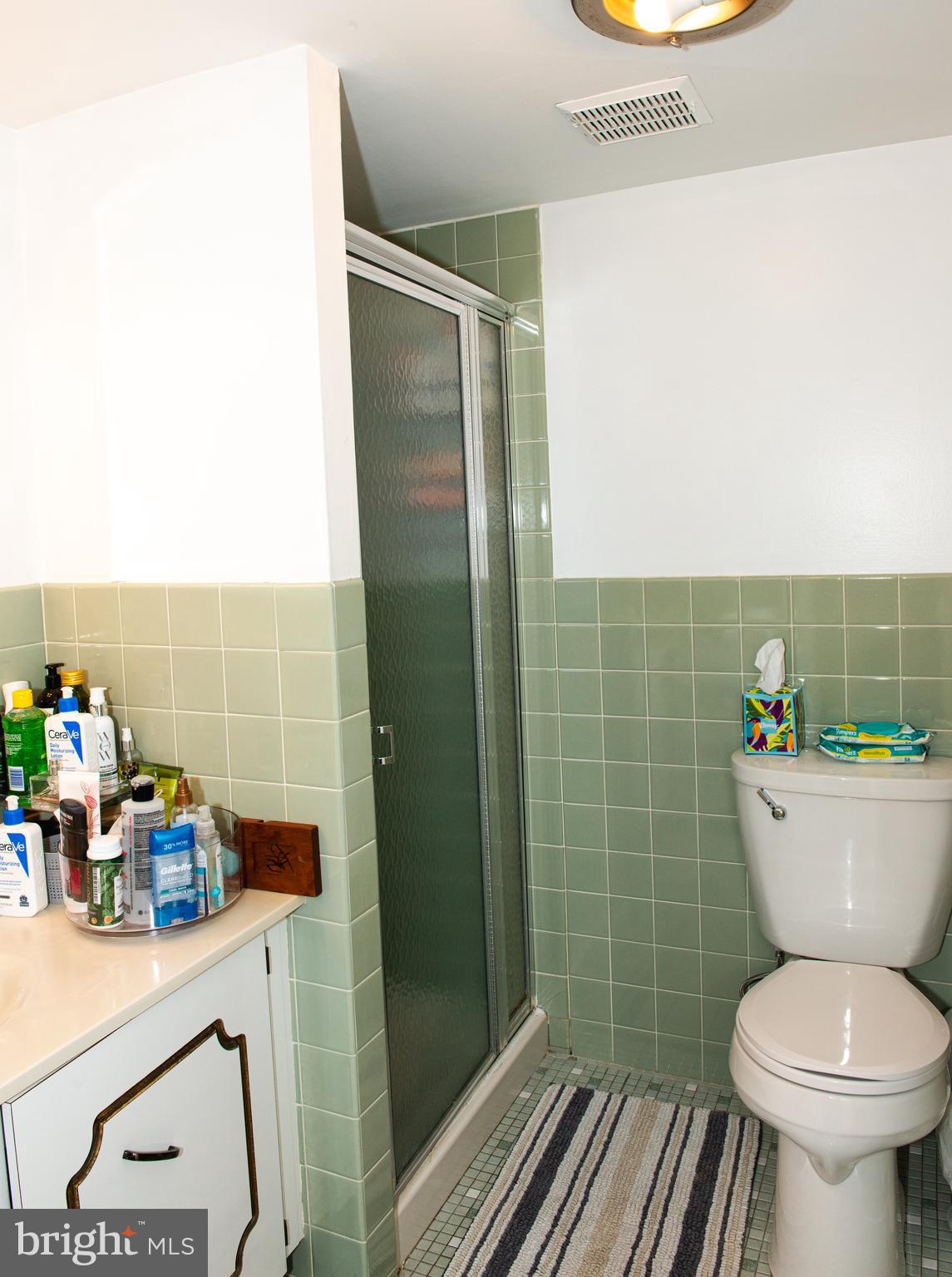 9908 Bustleton Avenue, Unit A8 Philadelphia, PA 19115 - Photo 16 of 24 a bathroom with a sink a toilet and a shower