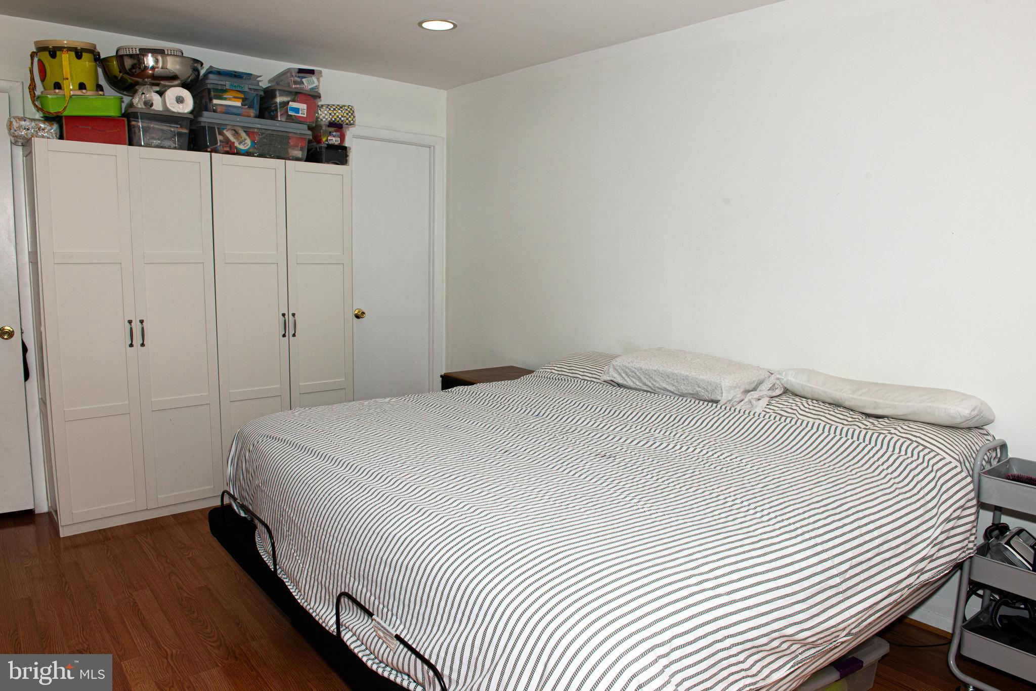 9908 Bustleton Avenue, Unit A8 Philadelphia, PA 19115 - Photo 18 of 24 a bedroom with a bed and a window