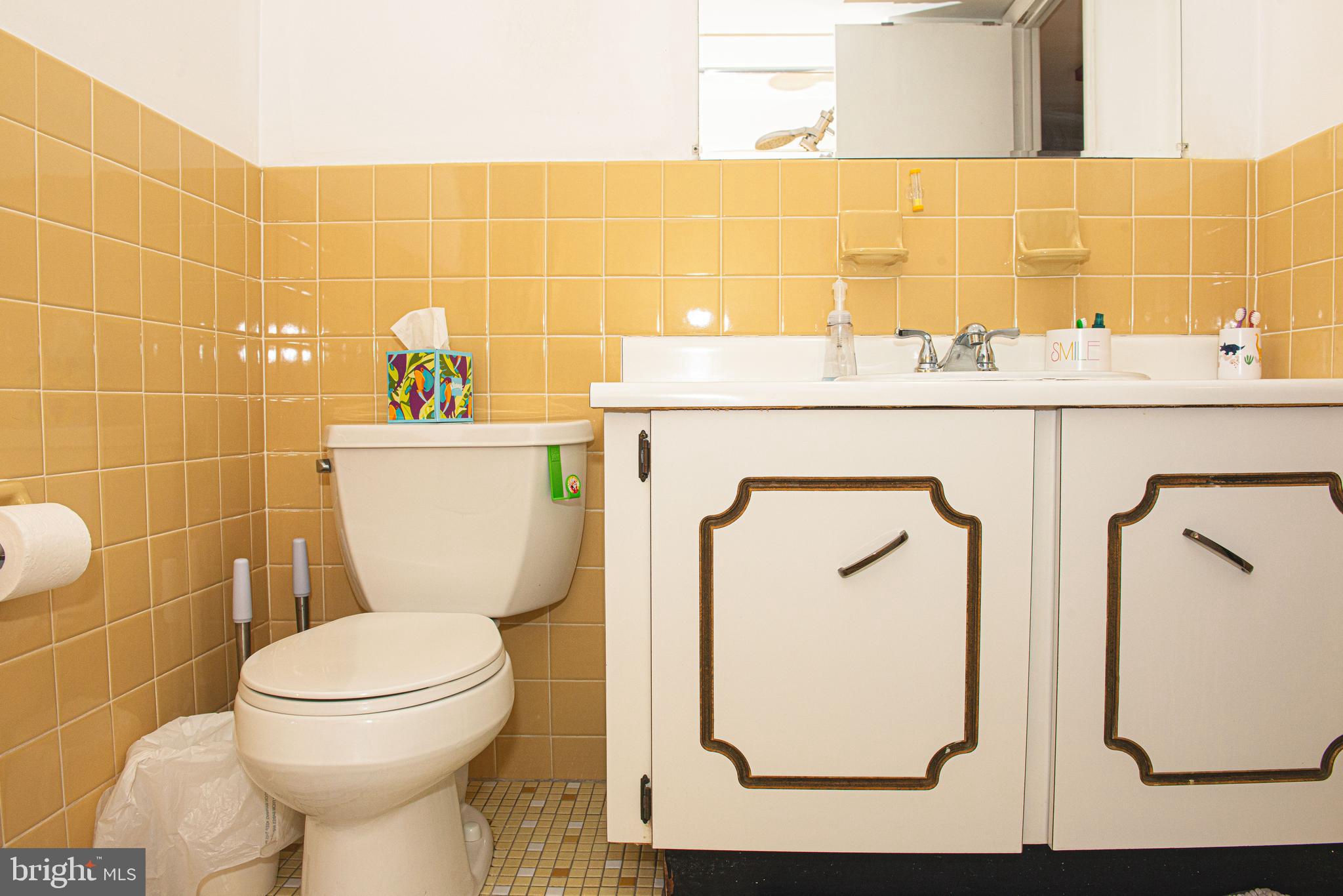 9908 Bustleton Avenue, Unit A8 Philadelphia, PA 19115 - Photo 19 of 24 a bathroom with a toilet sink and mirror