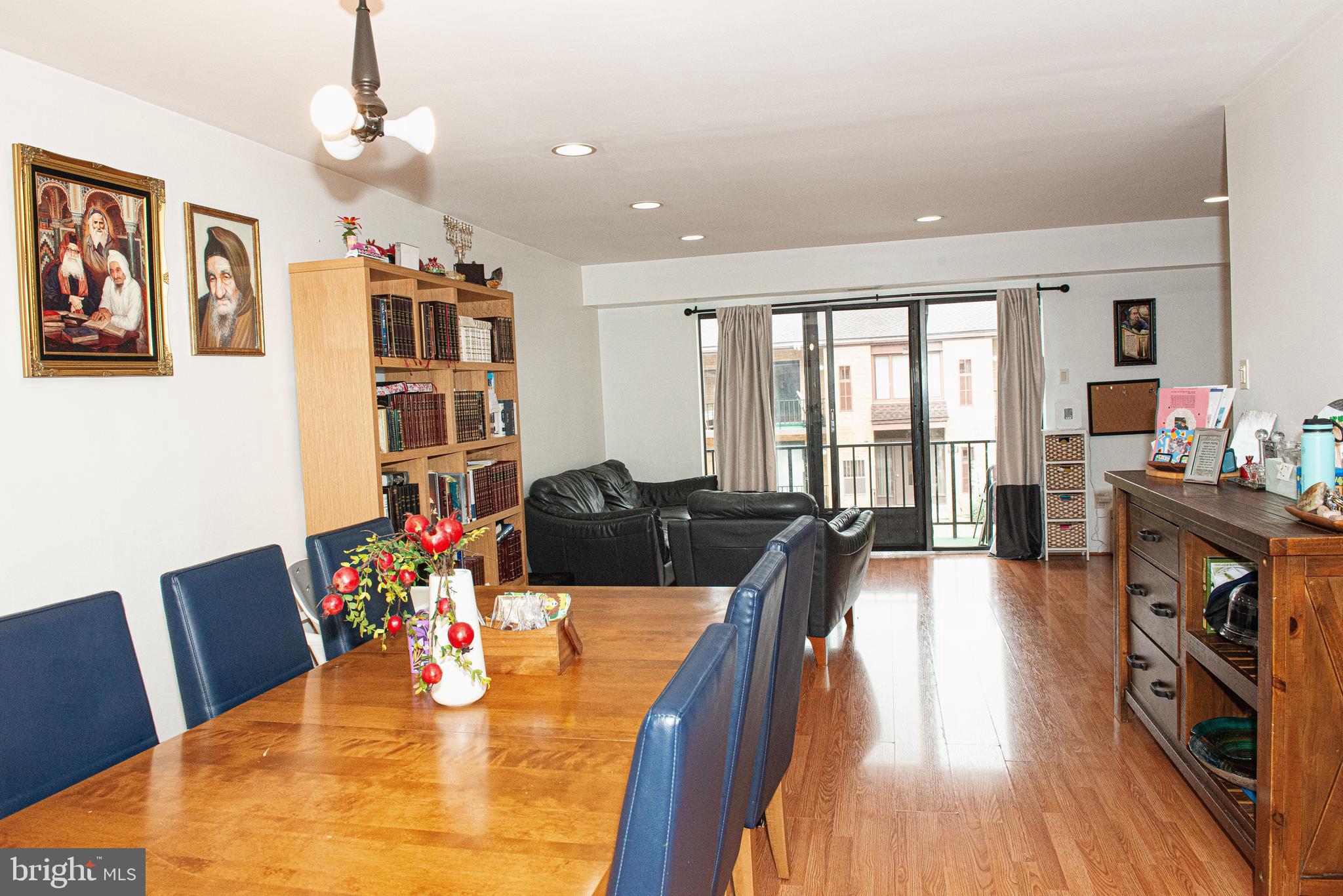9908 Bustleton Avenue, Unit A8 Philadelphia, PA 19115 - Photo 5 of 24 a view of a dining room with furniture a chandelier and wooden floor