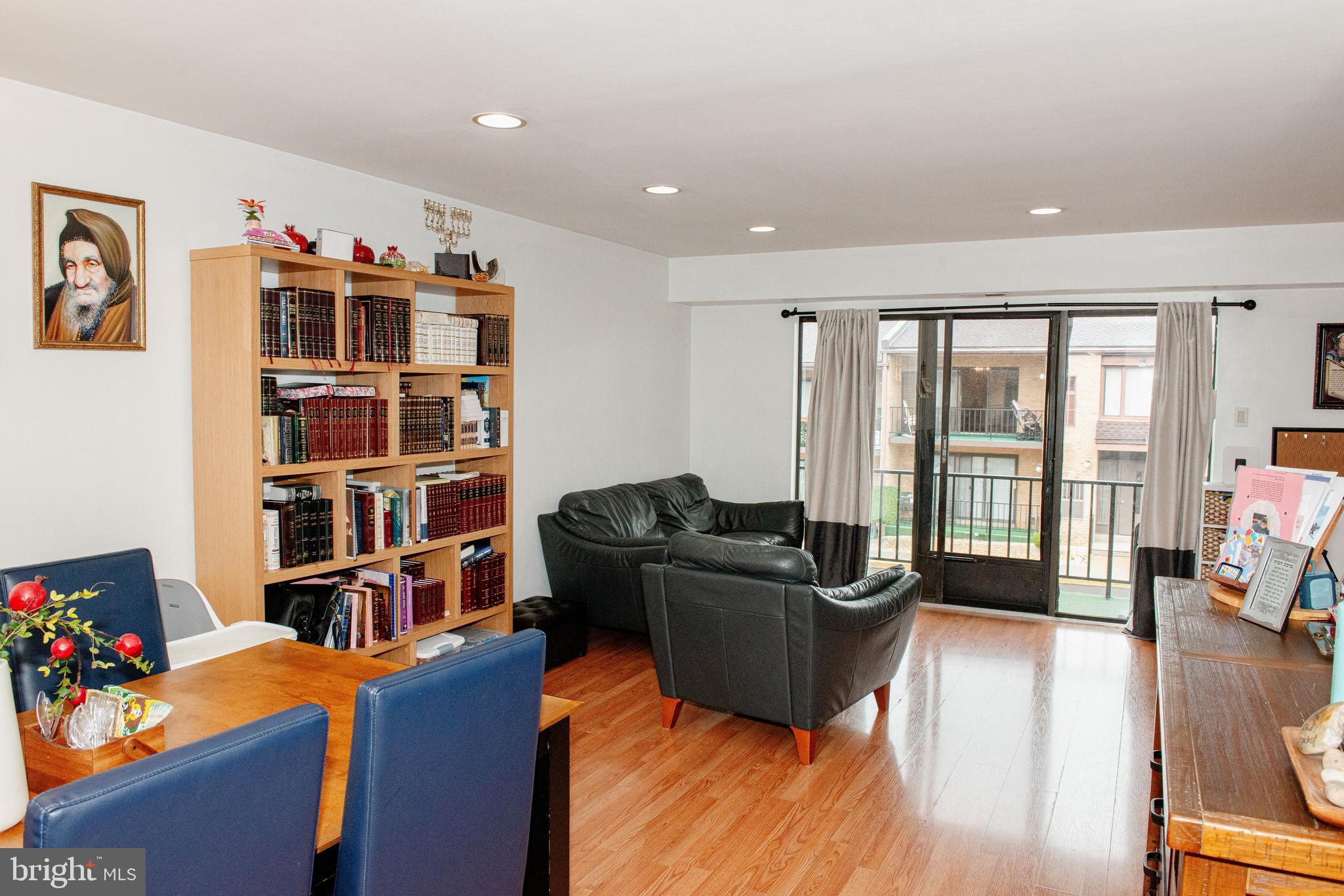 9908 Bustleton Avenue, Unit A8 Philadelphia, PA 19115 - Photo 7 of 24 a living room with furniture toys and a flat screen tv