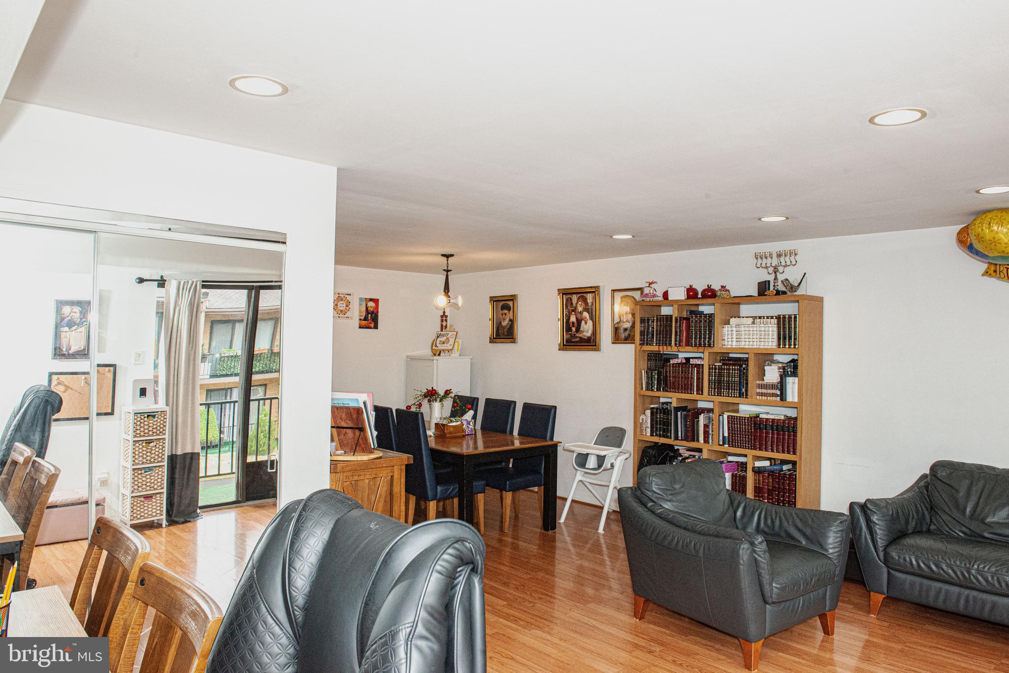9908 Bustleton Avenue, Unit A8 Philadelphia, PA 19115 - Photo 9 of 24 a living room with furniture and a book shelf
