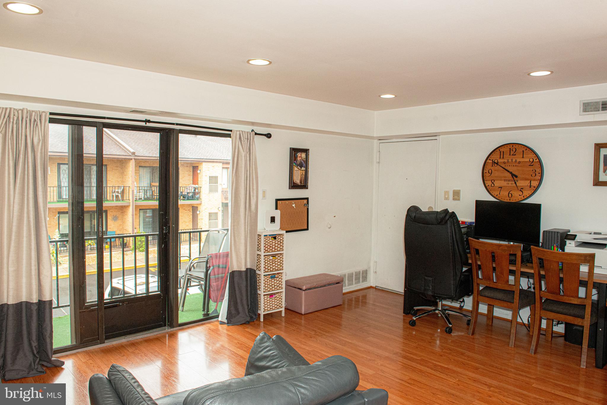 9908 Bustleton Avenue, Unit A8 Philadelphia, PA 19115 - Photo 10 of 24 a living room with furniture and a window