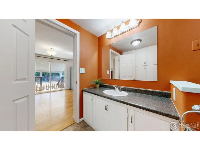 a living room with a bed furniture and a window