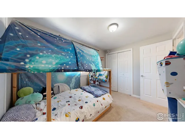 a living room with furniture and a dining table with wooden floor