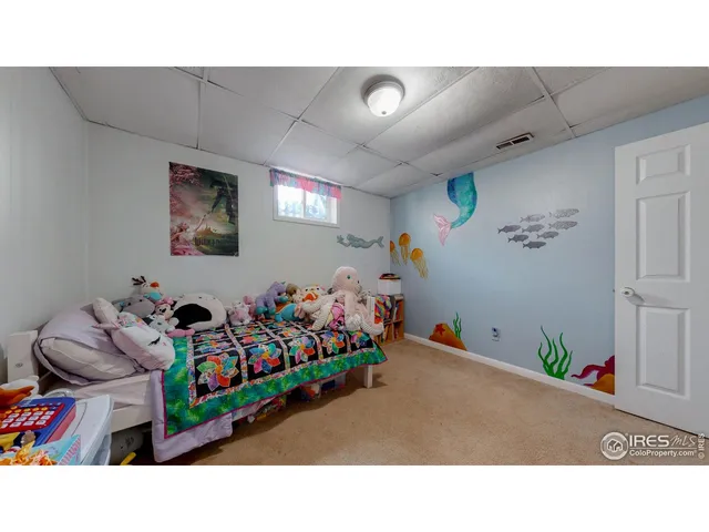 a bathroom with a sink vanity mirror and toilet