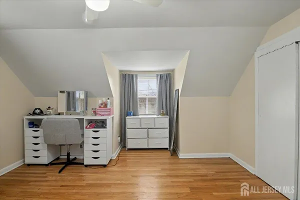 a view of a bedroom with baby cabinets