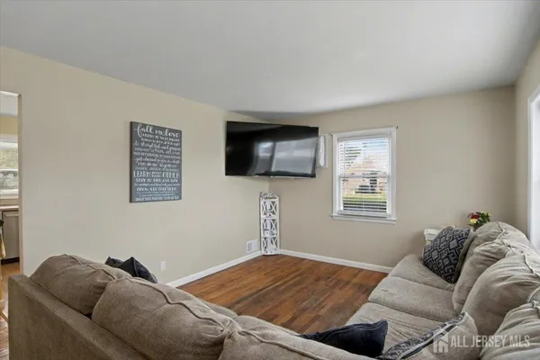 a bedroom with a bed furniture and a flat screen tv
