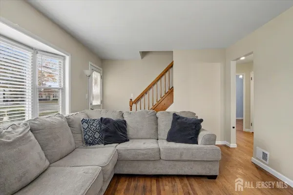 a living room with furniture and a large window