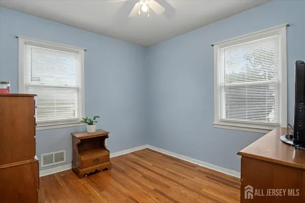 a room with chair and windows