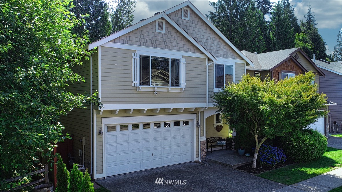 4524 147th Place Southeast Bothell, WA 98012 - Photo 1 of 33 a view of a house with a yard and potted plants