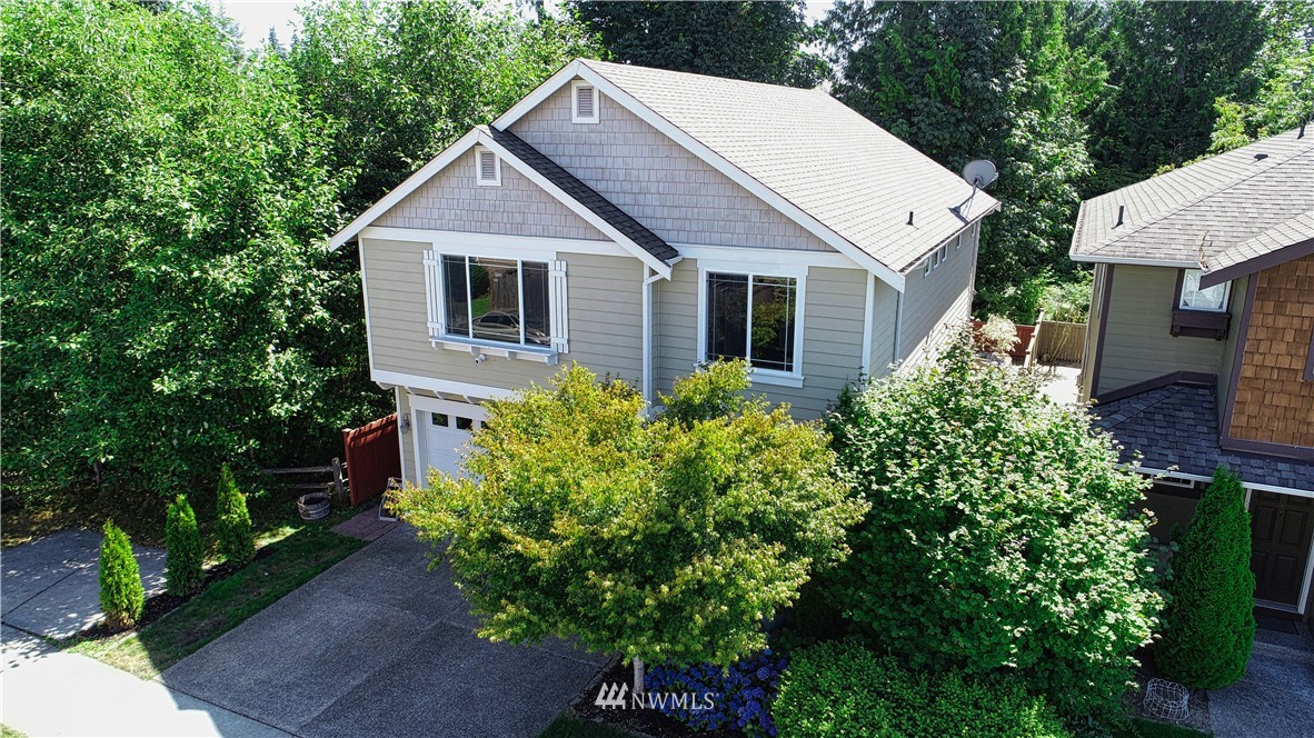 4524 147th Place Southeast Bothell, WA 98012 - Photo 2 of 33 a view of a house with brick walls and a flower garden