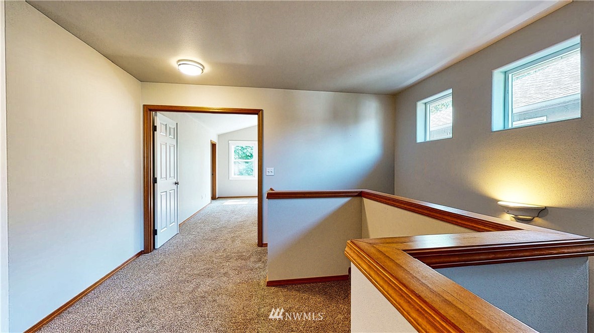 4524 147th Place Southeast Bothell, WA 98012 - Photo 15 of 33 a view of a room with wooden floor and staircase