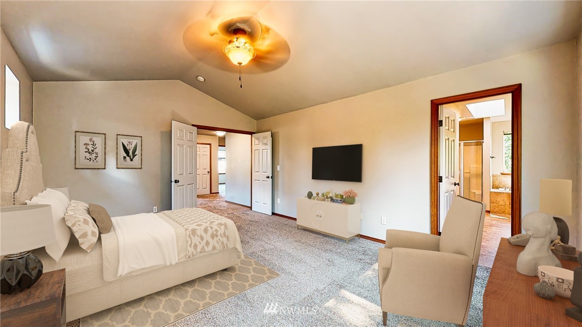 4524 147th Place Southeast Bothell, WA 98012 - Photo 19 of 33 a bedroom with a bed and a flat screen tv