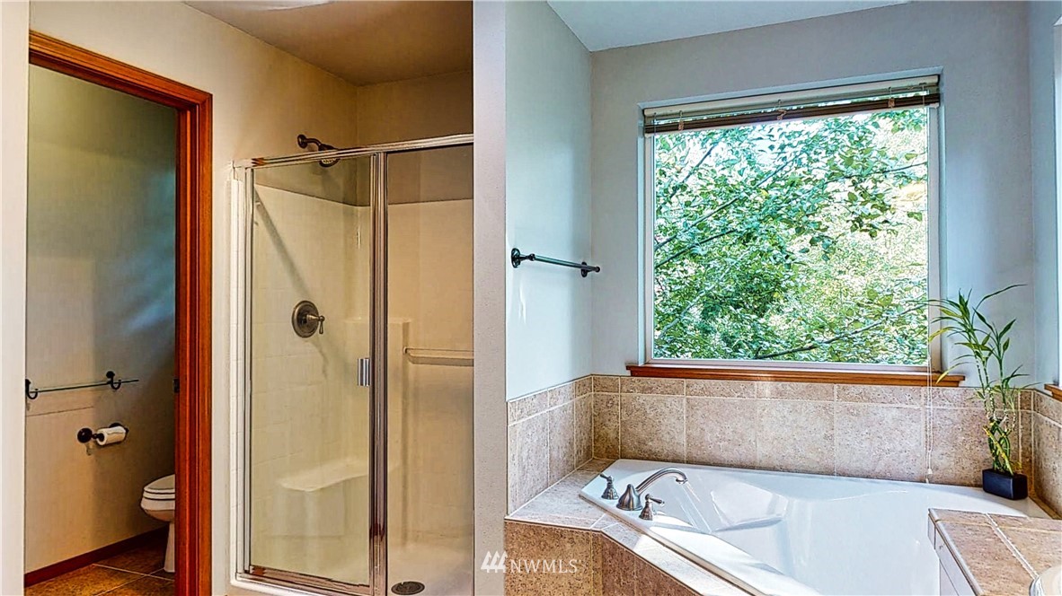 4524 147th Place Southeast Bothell, WA 98012 - Photo 21 of 33 a bathroom with a tub and shower