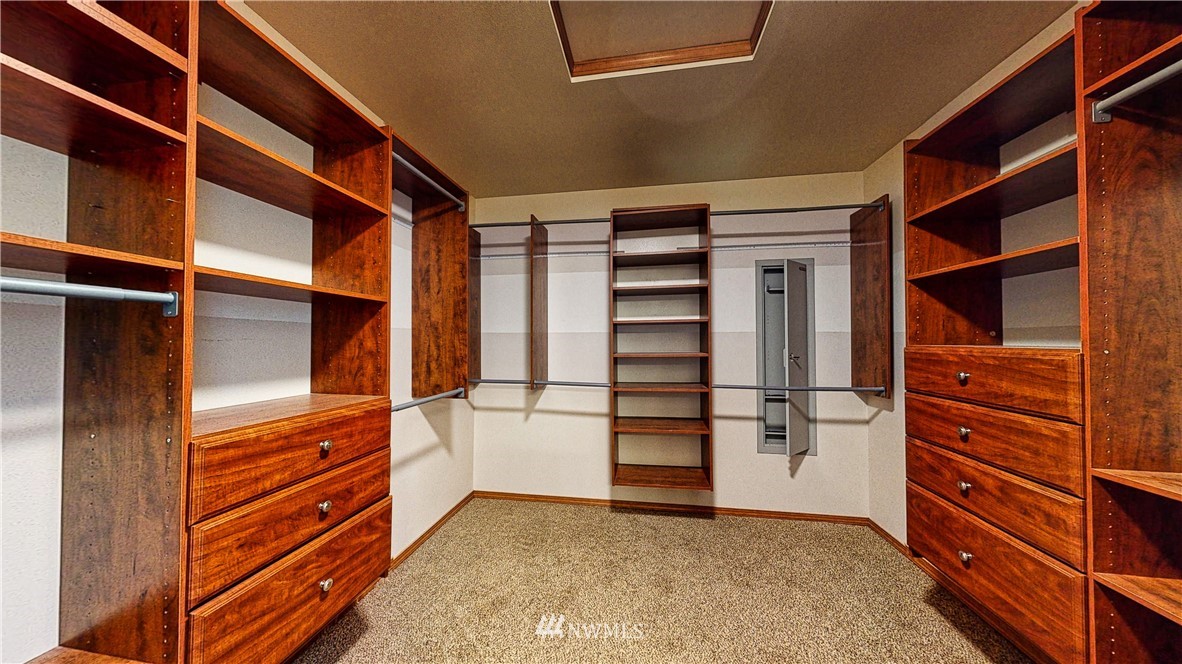 4524 147th Place Southeast Bothell, WA 98012 - Photo 22 of 33 a view of walk in closet with clothes and shoes
