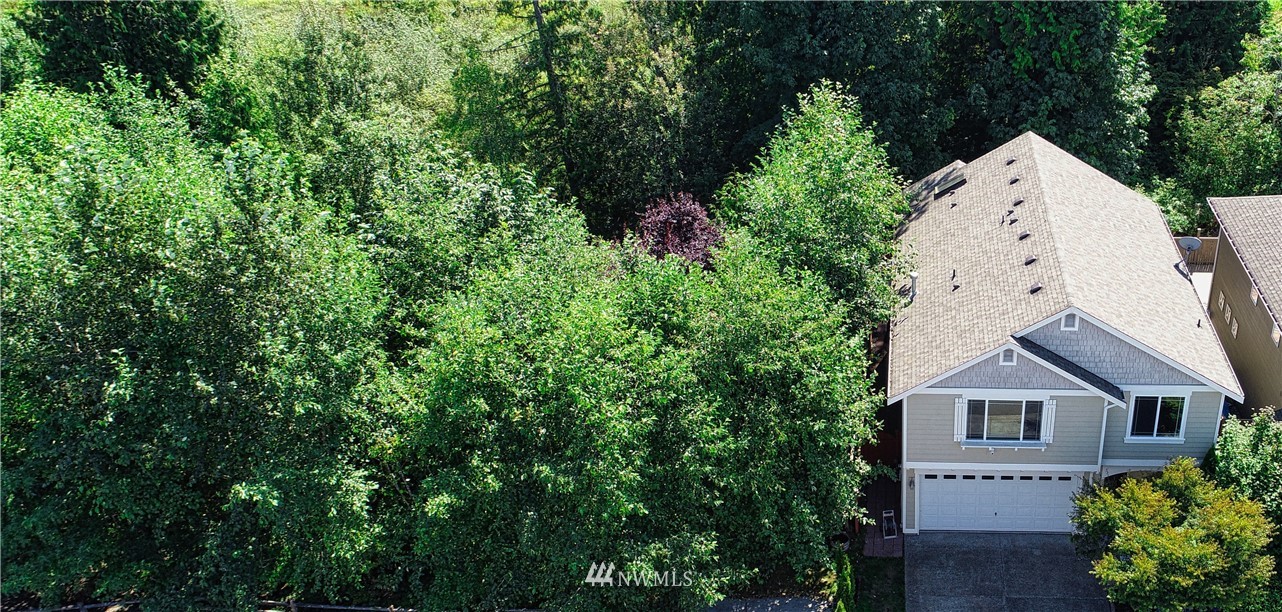 4524 147th Place Southeast Bothell, WA 98012 - Photo 32 of 33 an aerial view of a house with a yard and large trees