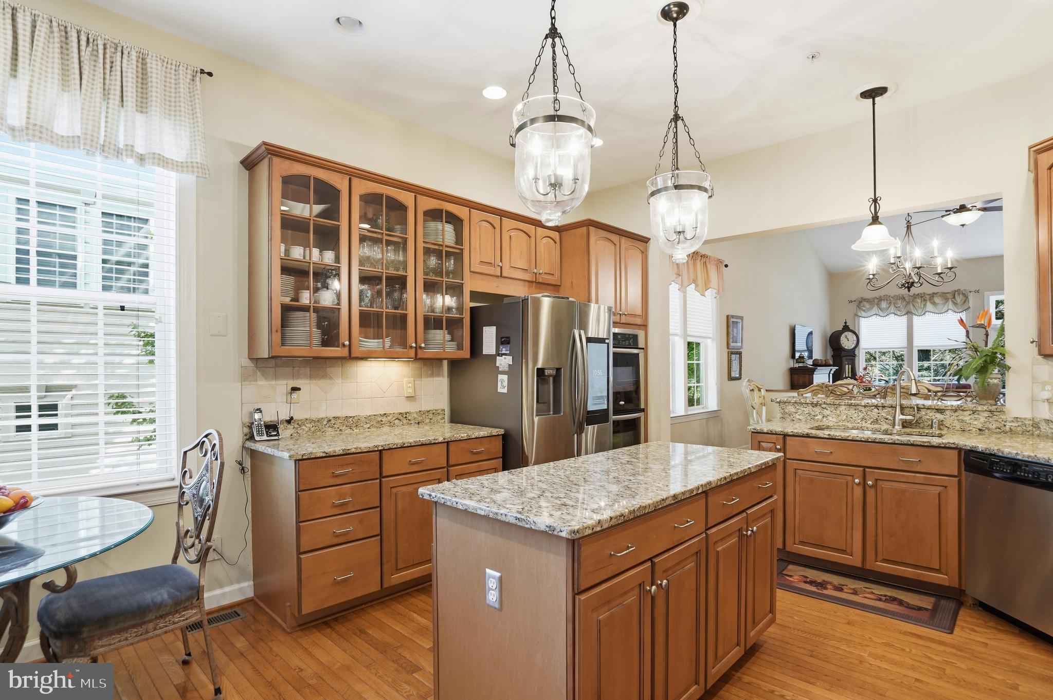 4109 Winterhazel Road, Unit 4109 Baltimore, MD 21208 - Photo 14 of 46 a kitchen with a stove center island and cabinets