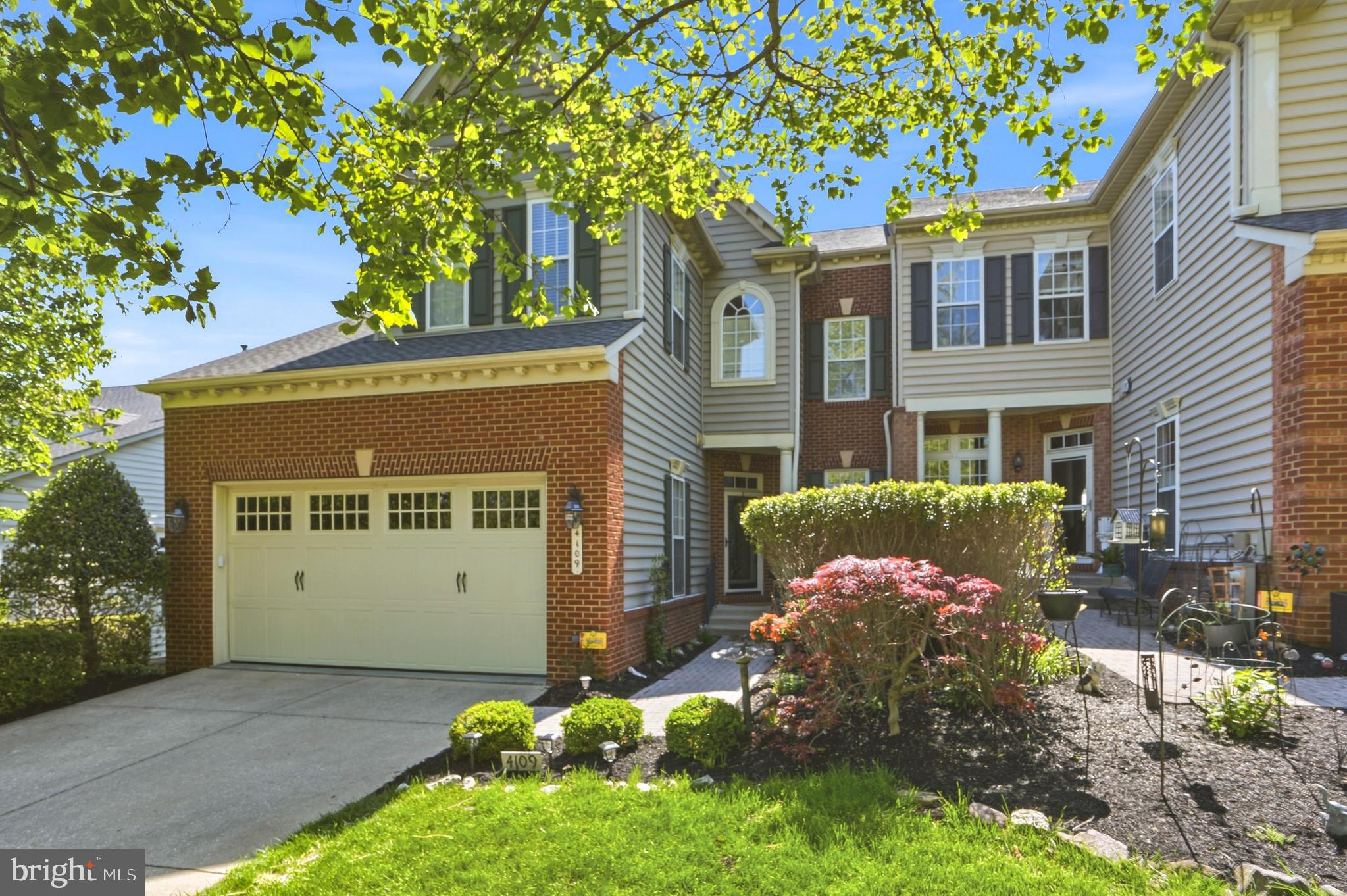 4109 Winterhazel Road, Unit 4109 Baltimore, MD 21208 - Photo 2 of 46 a front view of a house with a yard