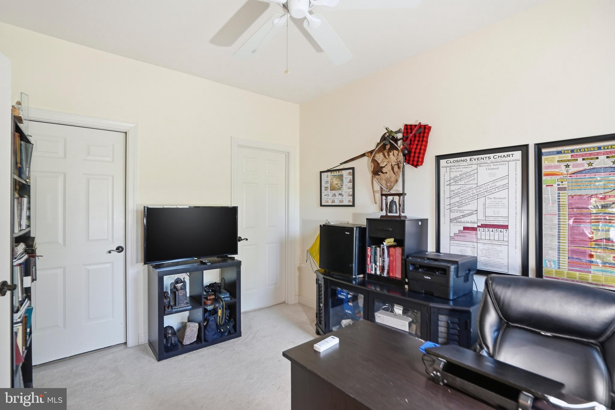 4109 Winterhazel Road, Unit 4109 Baltimore, MD 21208 - Photo 26 of 46 a living room with furniture and a flat screen tv
