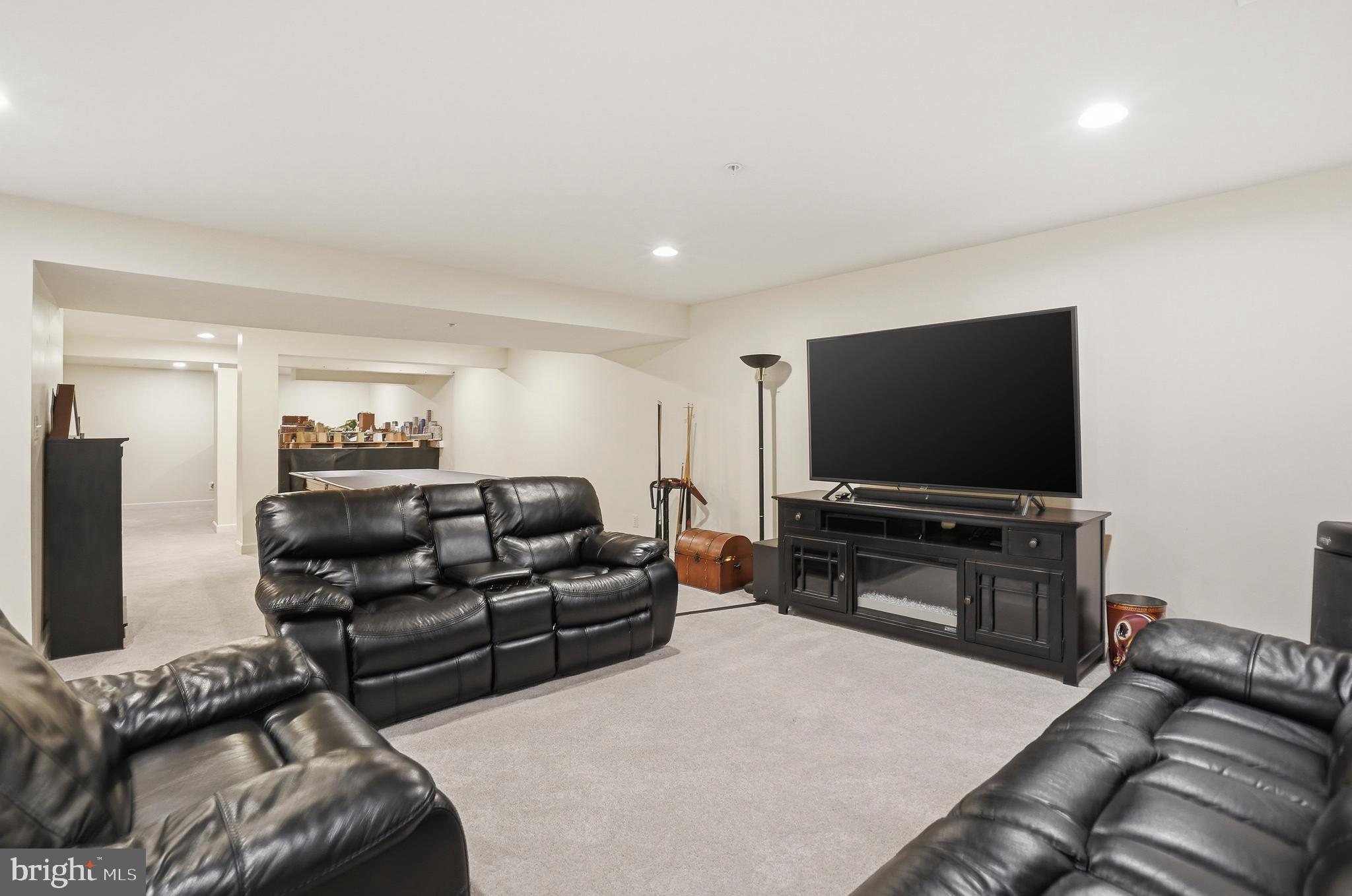 4109 Winterhazel Road, Unit 4109 Baltimore, MD 21208 - Photo 33 of 46 a living room with furniture and a flat screen tv