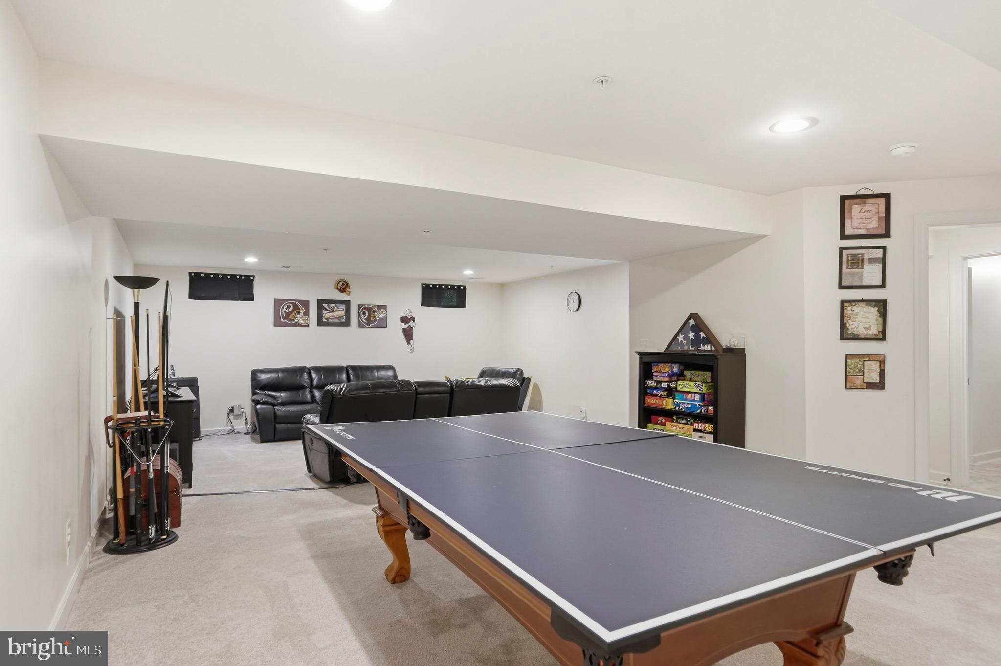 4109 Winterhazel Road, Unit 4109 Baltimore, MD 21208 - Photo 35 of 46 a living room with furniture pool table and flat screen tv