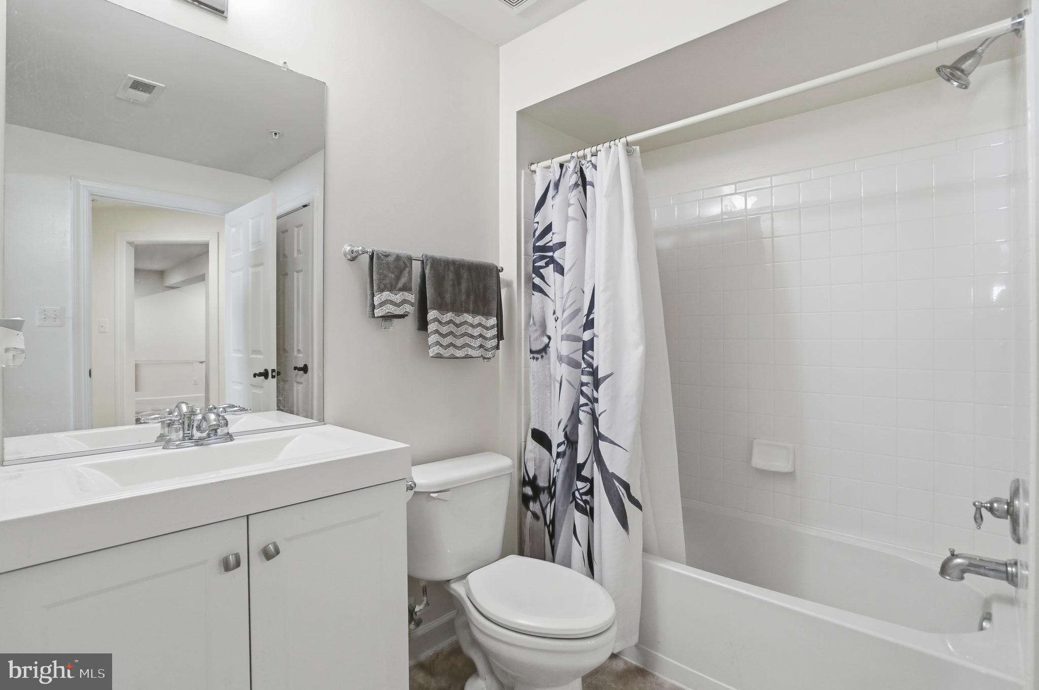 4109 Winterhazel Road, Unit 4109 Baltimore, MD 21208 - Photo 38 of 46 a bathroom with a sink toilet and shower