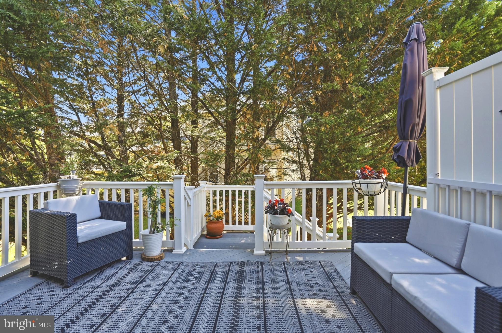 4109 Winterhazel Road, Unit 4109 Baltimore, MD 21208 - Photo 39 of 46 a balcony with wooden floor and outdoor seating