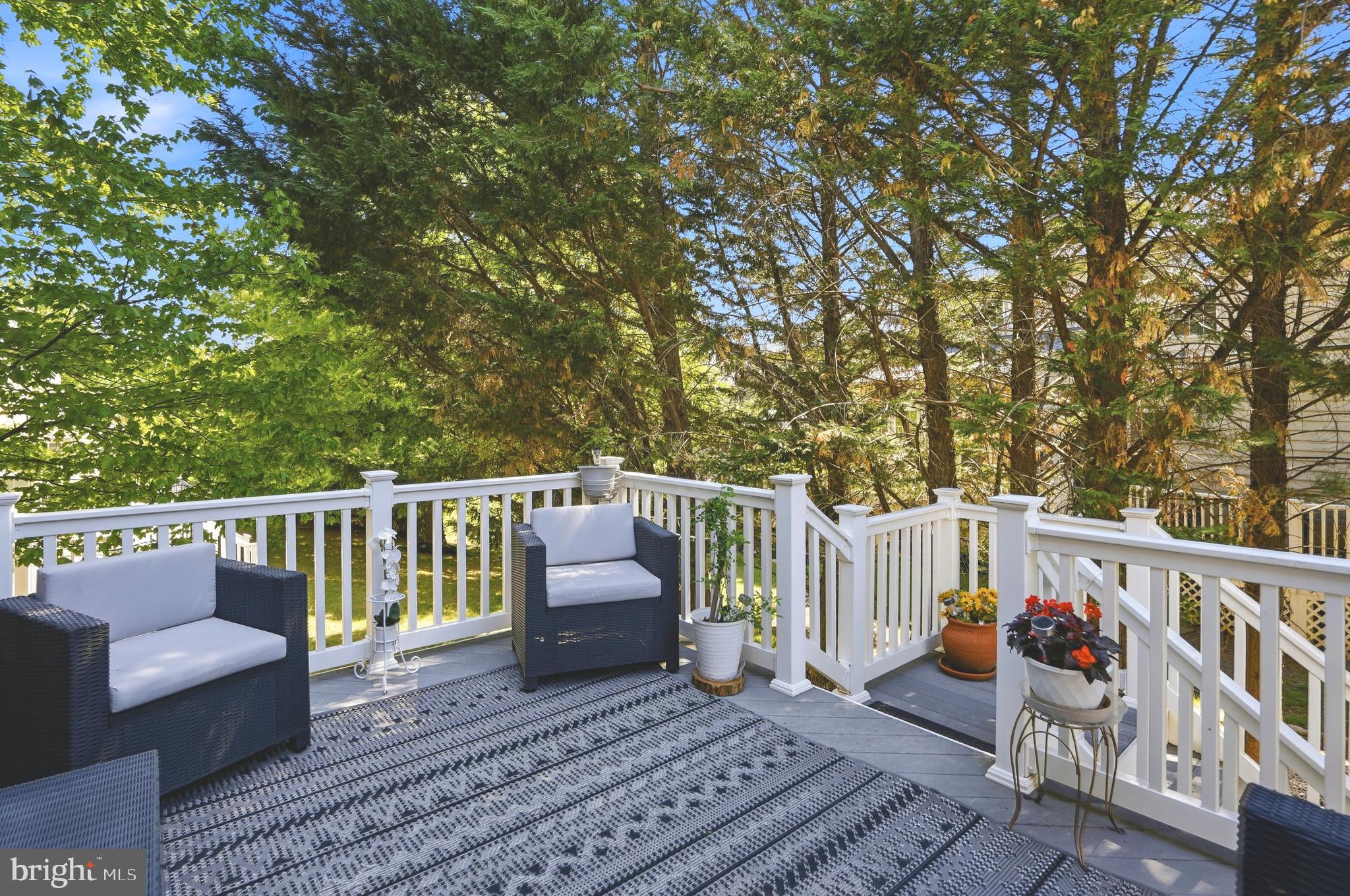 4109 Winterhazel Road, Unit 4109 Baltimore, MD 21208 - Photo 40 of 46 a balcony with wooden floor and outdoor seating