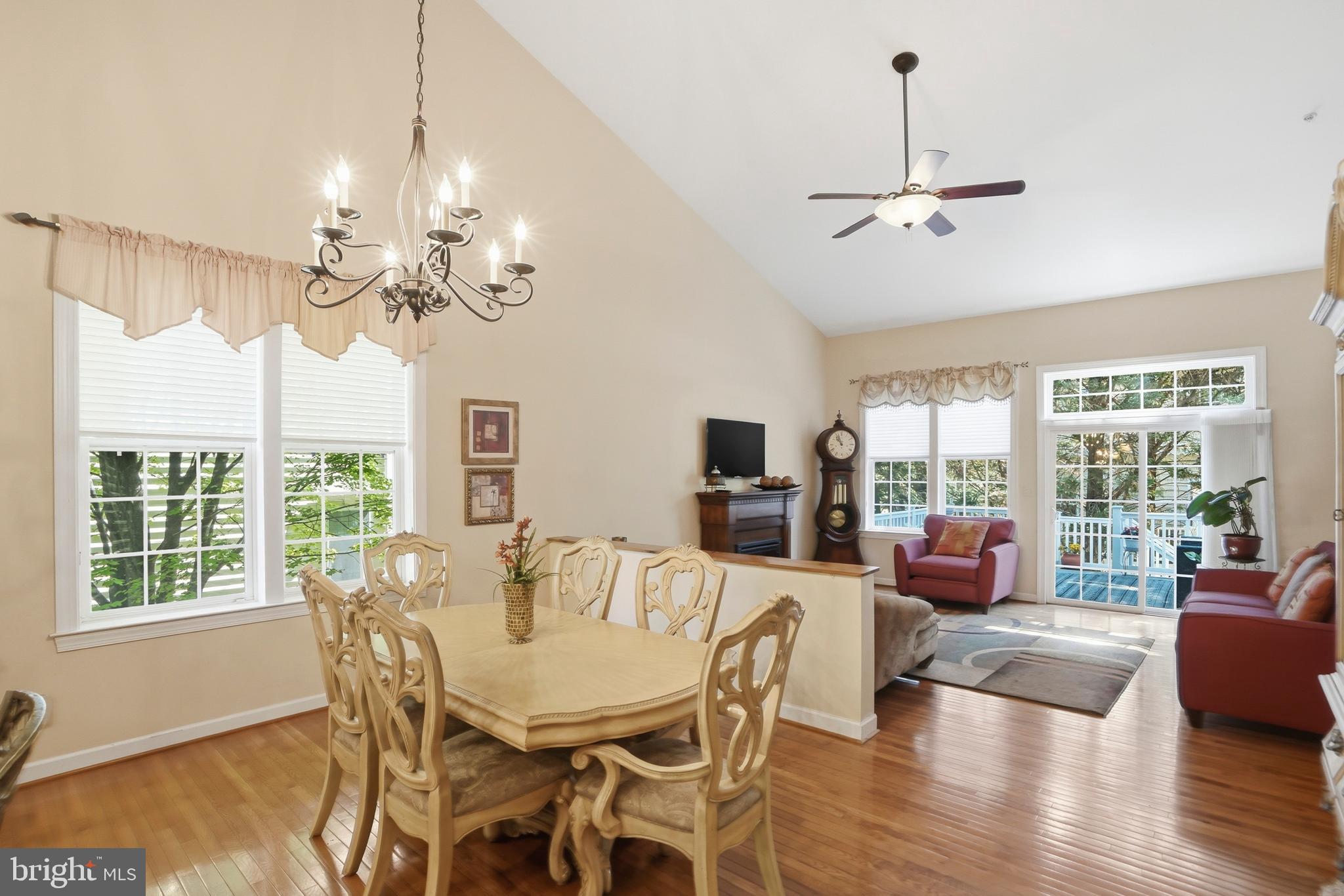 4109 Winterhazel Road, Unit 4109 Baltimore, MD 21208 - Photo 8 of 46 a view of a dining room with furniture wooden floor and chandelier