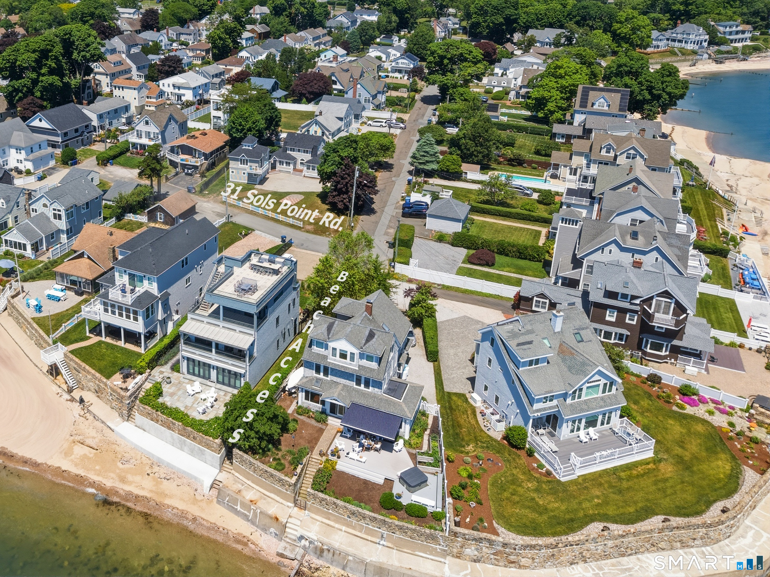 Renovated home on a .25-acre corner lot, steps from a private beach.
