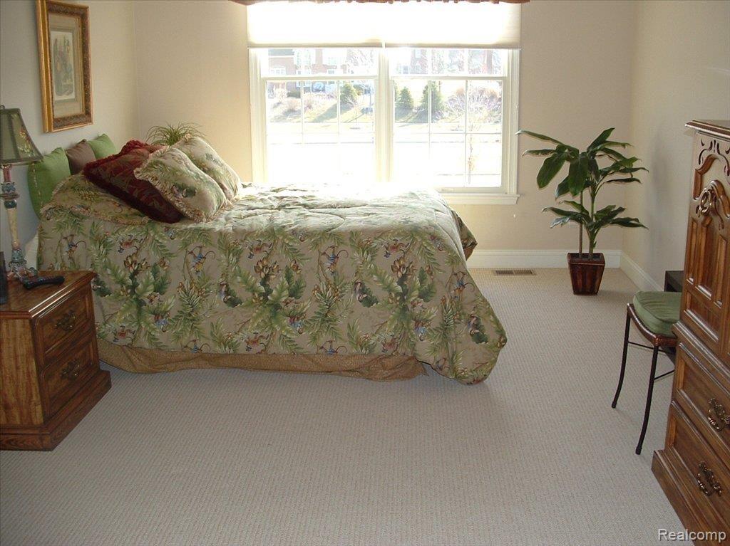 24827 Reeds Pointe Drive, Unit 26 Novi, MI 48374 - Photo 19 of 21 Upstairs bedroom