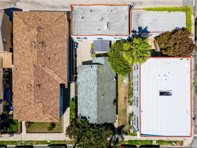 front view of a house with a potted plant