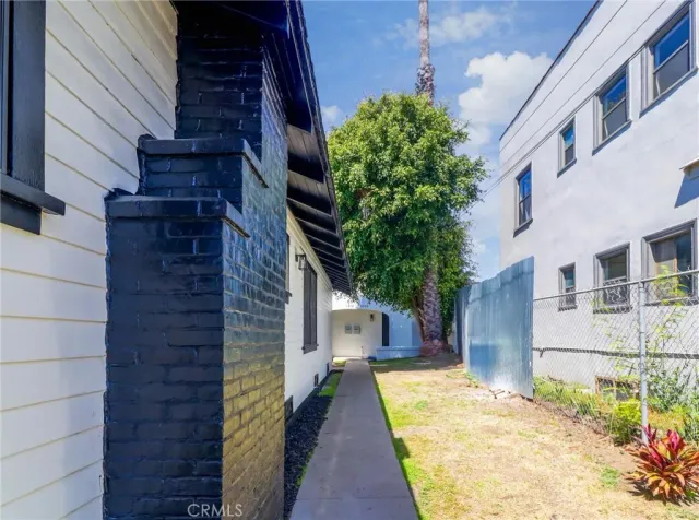 a view of a brick house with a large windows