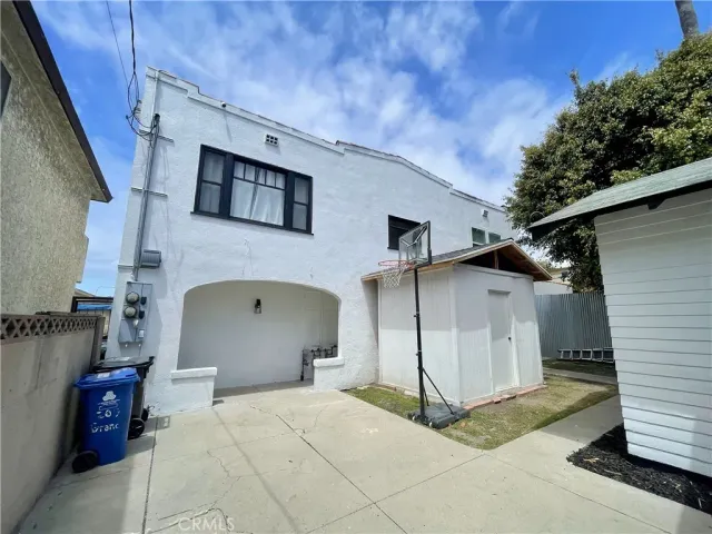 a view of a white house with many windows