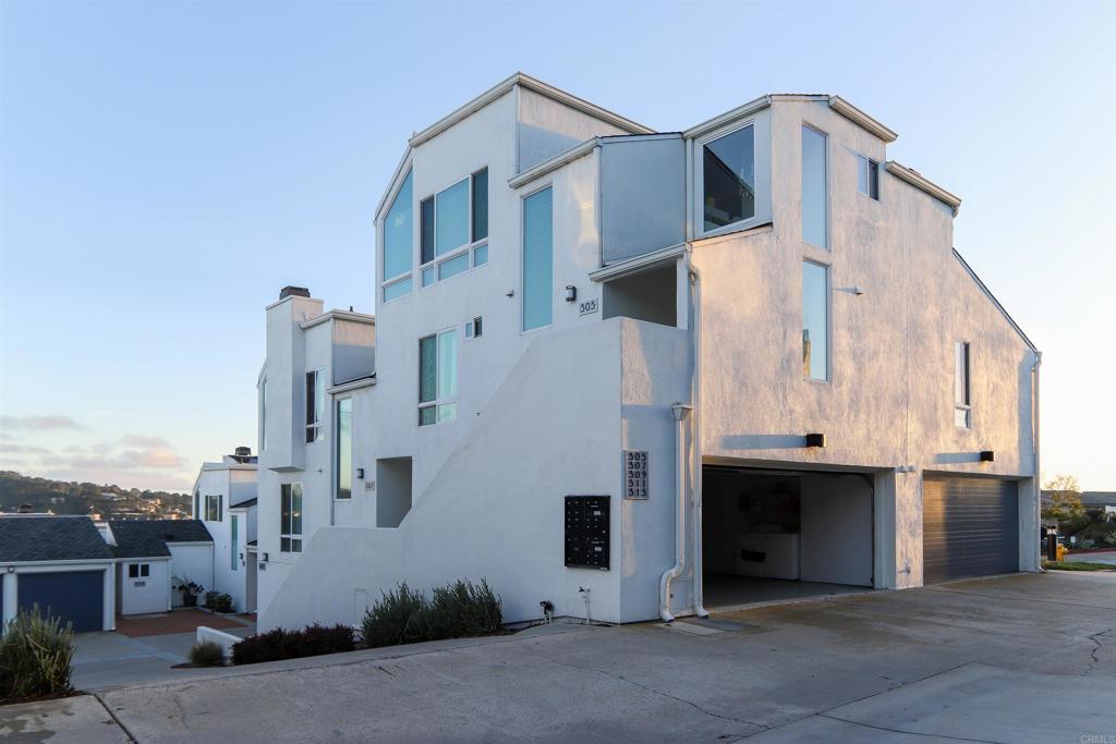 a front view of a house with a garage