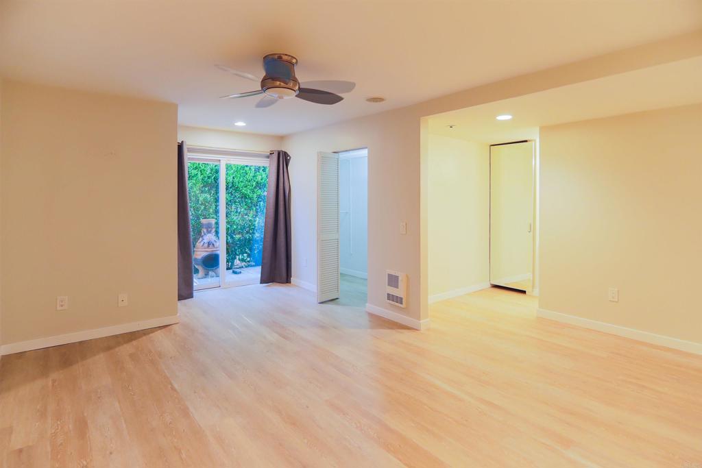 307 Shoemaker Lane Solana Beach, CA 92075 - Photo 12 of 31 a view of an empty room with glass door and a window