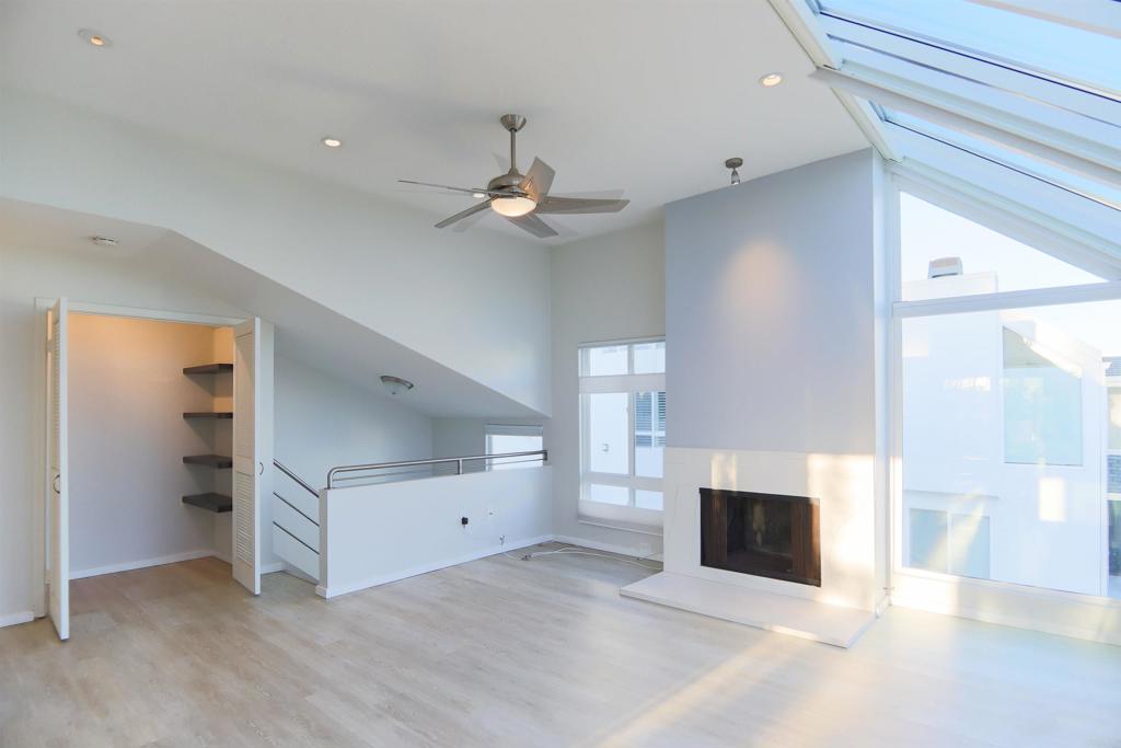 307 Shoemaker Lane Solana Beach, CA 92075 - Photo 2 of 31 an empty room with windows and fireplace